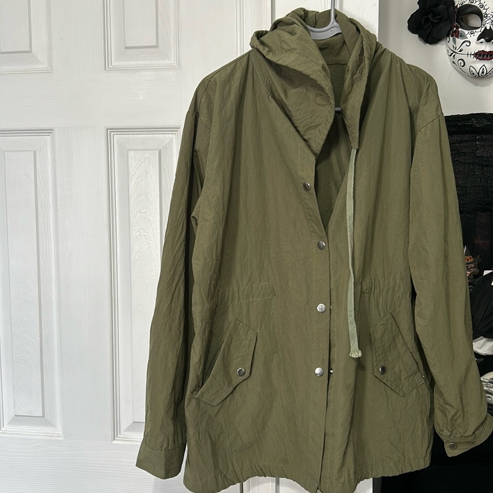 Green spring jacket. Size large with hood  skull on back pre owned